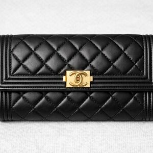 CHANEL Black Quilted Clutch with Gold Accent